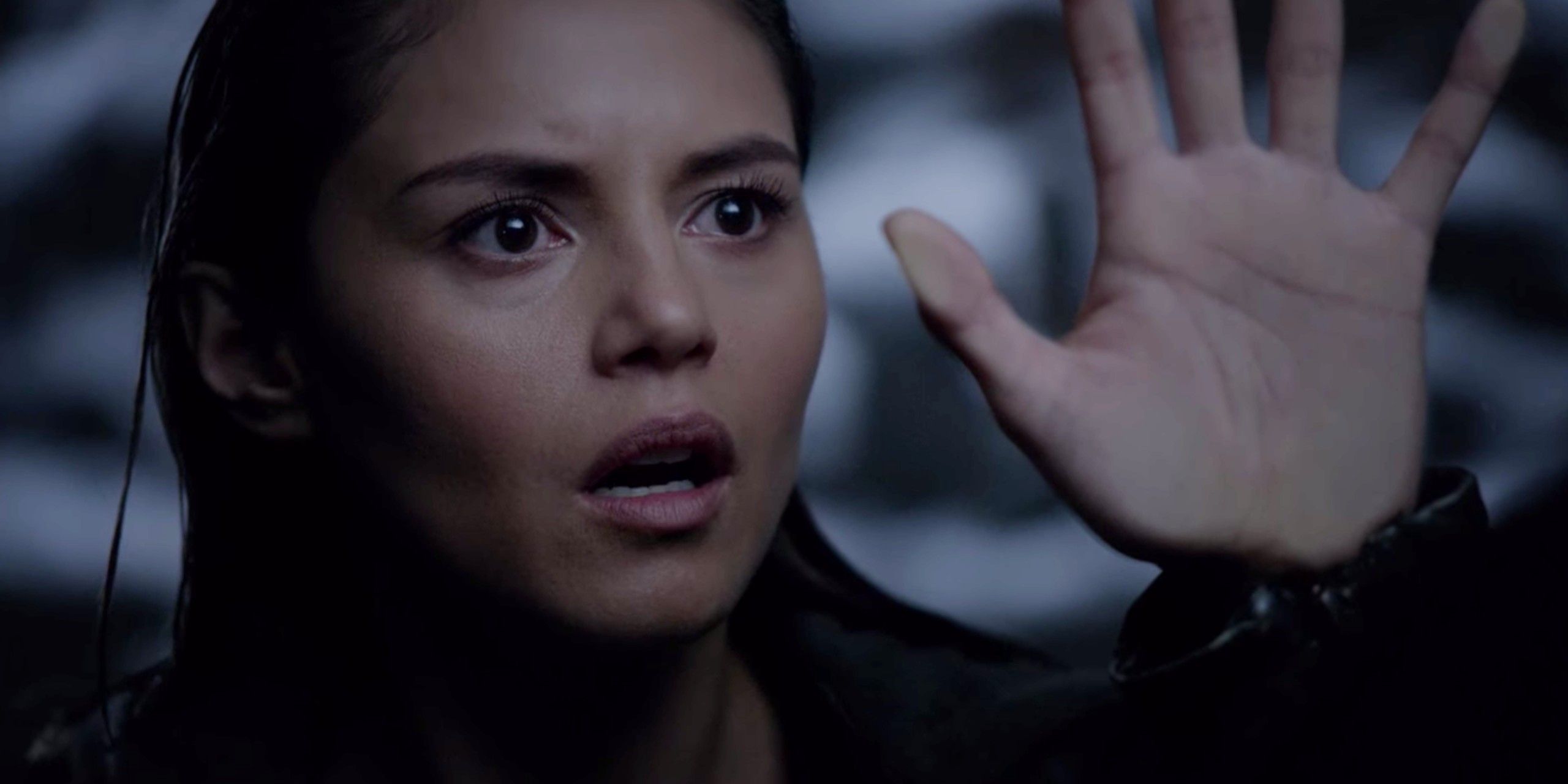 Rayna Cruz putting her hand on an invisible wall in The Vampire Diaries