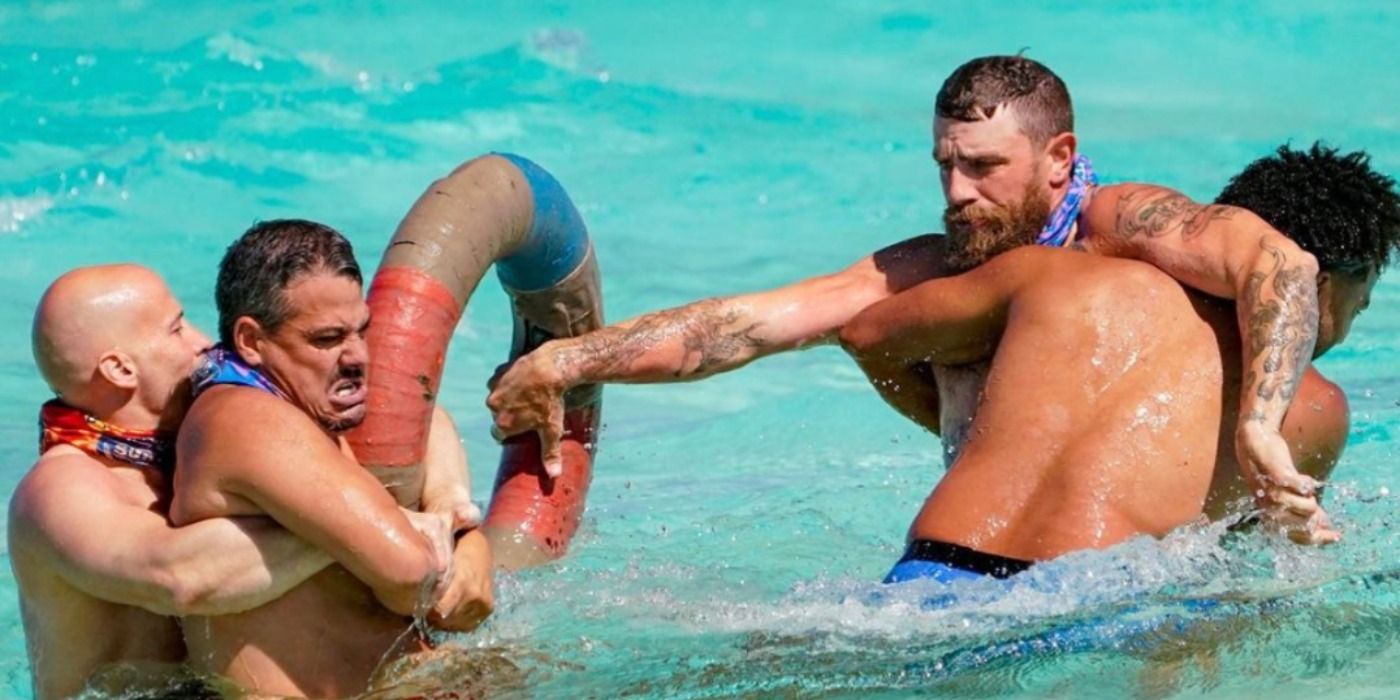 Contestants grapple in water during the Any Means Necessary challenge on Survivor
