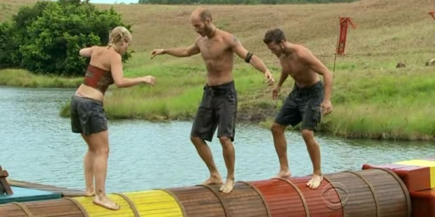 Competitors on Survivor compete in the Log Jam challenge