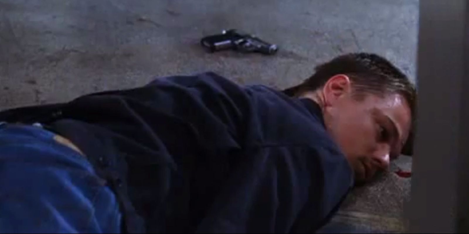Billy laying on the ground in The Departed