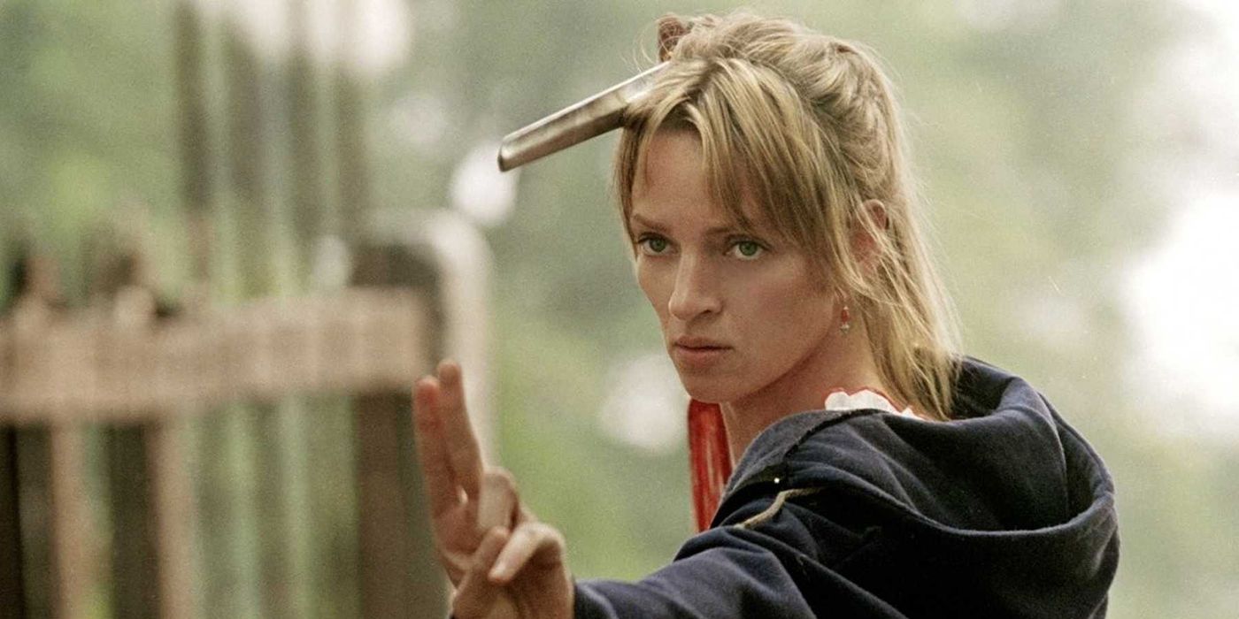 Uma Thurman in a hoodie, doing martial arts in a scene from Kill Bill.