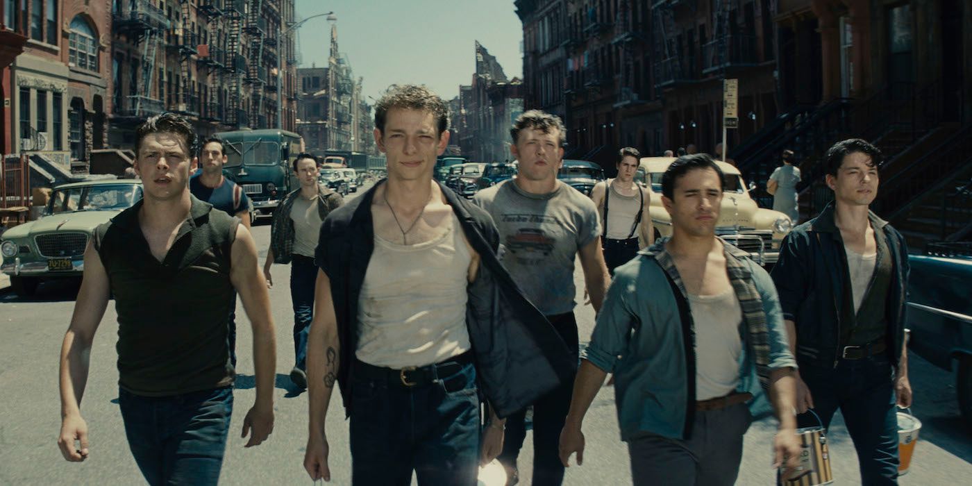 Riff and the Jets walk down the street in West Side Story (2021)