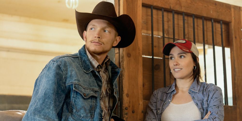 Jimmy and Mia stand together at the stables in Yellowstone