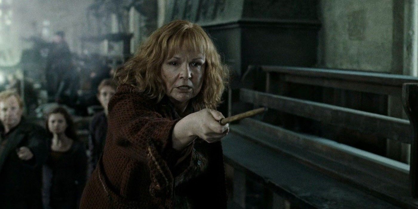 Molly Weasley, wand pointed out, with Weasley family in the background in Harry Potter