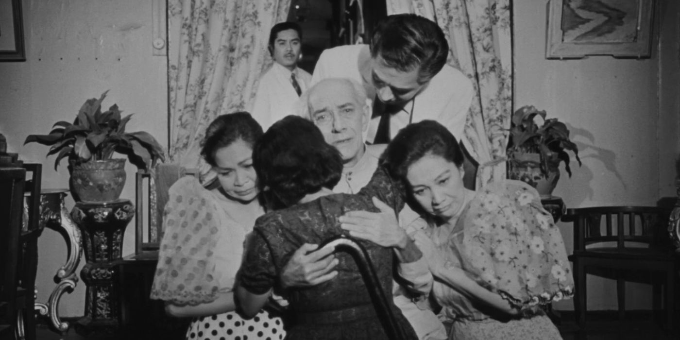 A Filipino family embracing in A Portrait Of The Artist As Filipino.