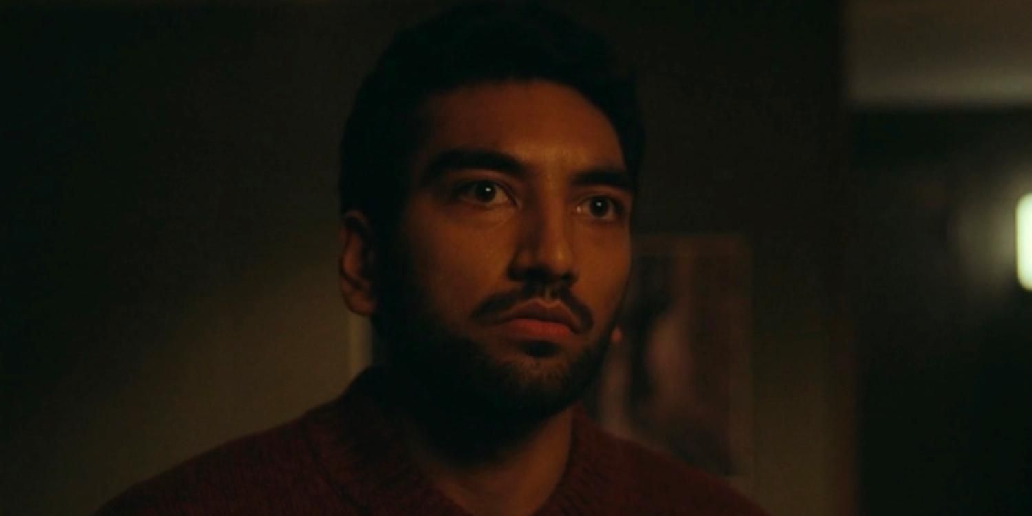 A closeup of Frank in a red sweater in Station Eleven