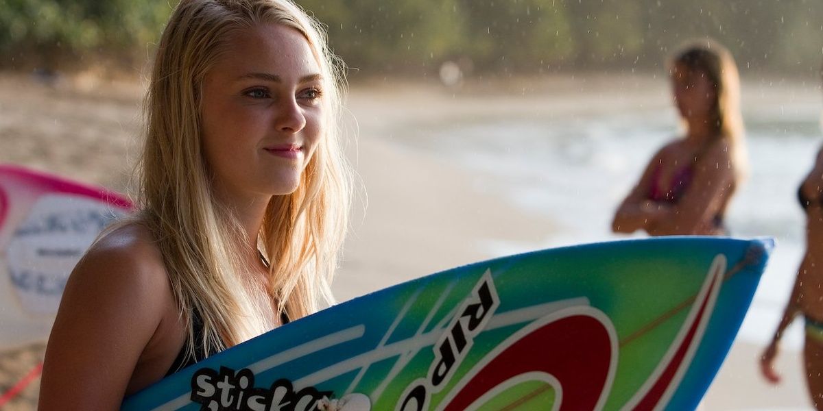 A girl holding a surfboard in Soul Surfer 