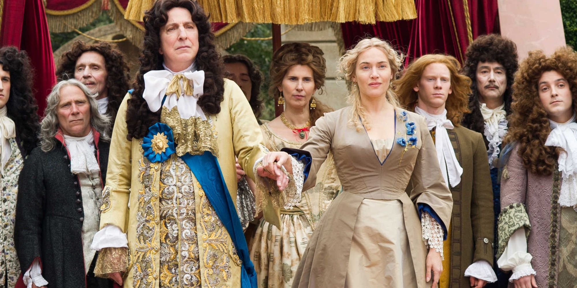Alan Rickman and Kate Winslet holding hands in A Little Chaos 