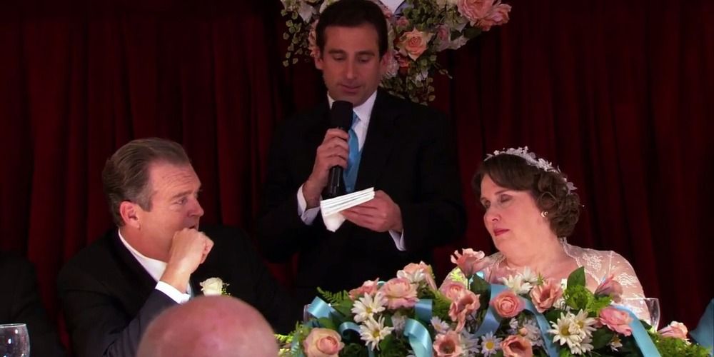 An image of Michael giving a speech at Phyllis and Bob's wedding in The Office