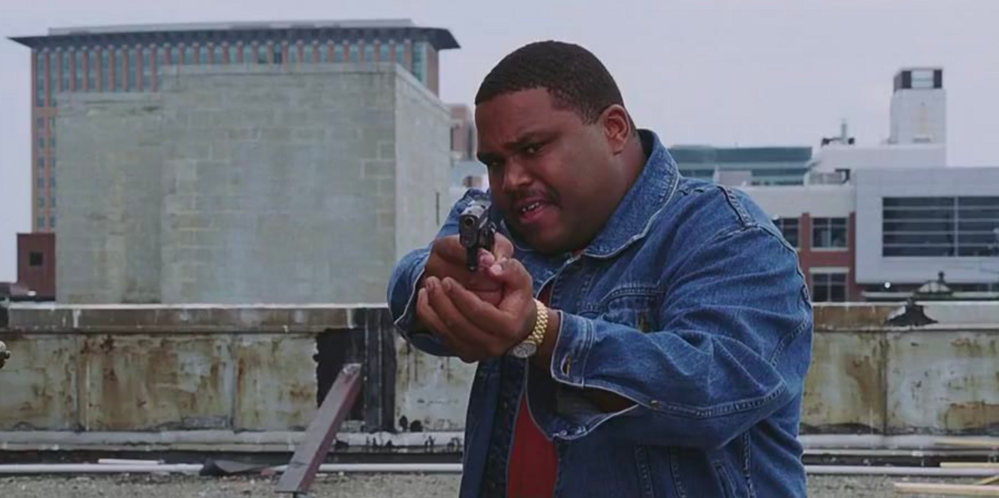 Anthony Anderson points a gun in The Departed