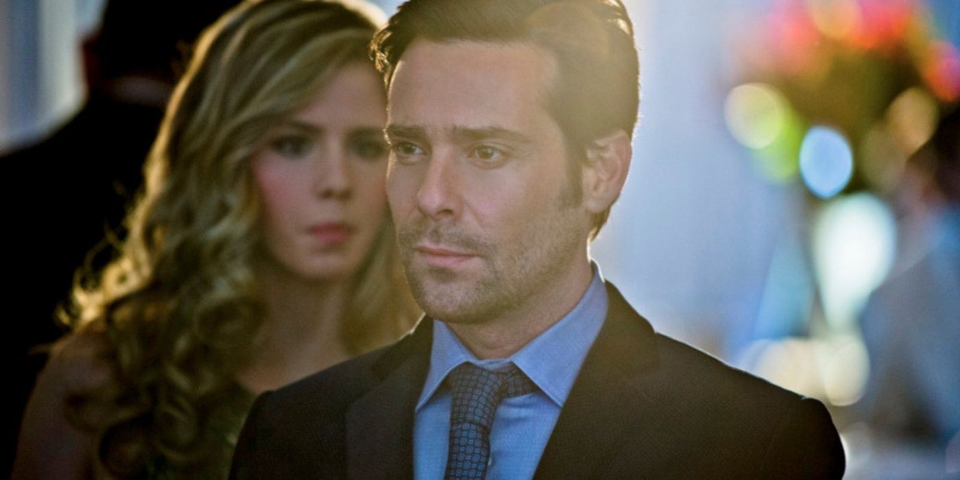 James Callis with a woman behind him in Arrow