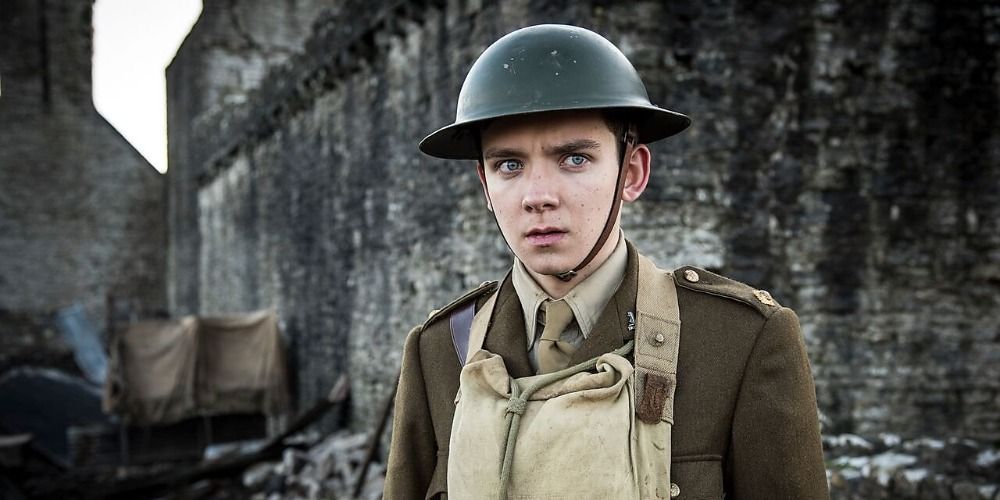 Asa Butterfield in Journey's End as a soldier standing amongst a ruined city