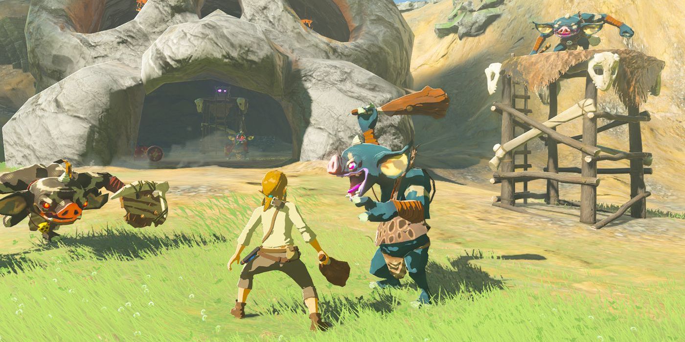 Link fighting Bokoblins in front of a skull-shaped building in The Legend of Zelda: Breath of the Wild