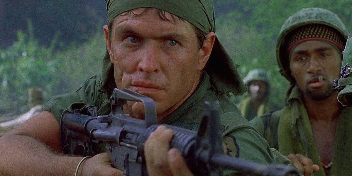 Sgt. Barnes aiming a rifle in Platoon