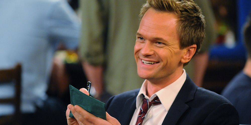 Barney Stinson writes on a napkin in How I Met Your Mother