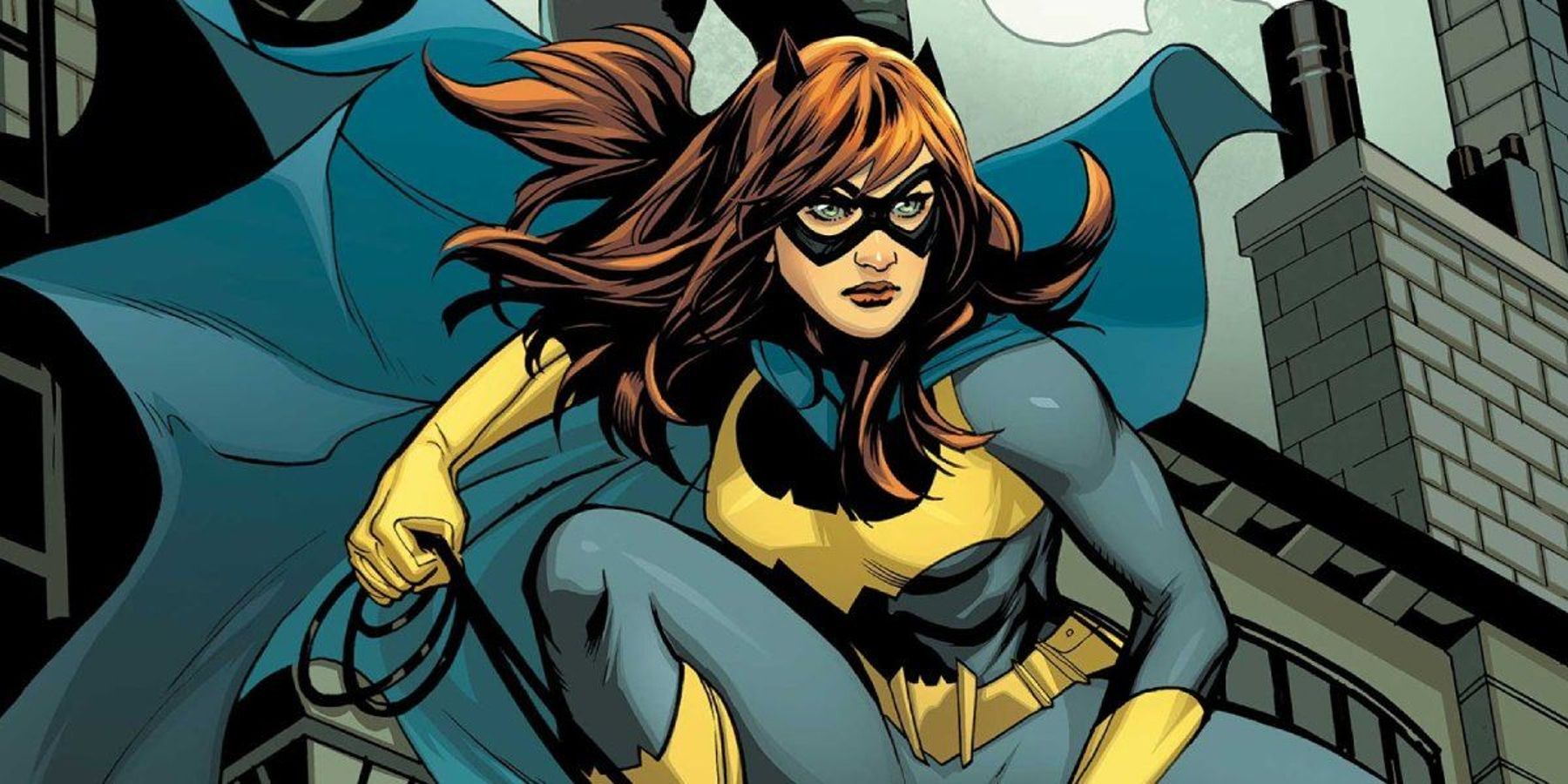 Batgirl in her Rebirth design perched on a rooftop in DC comics