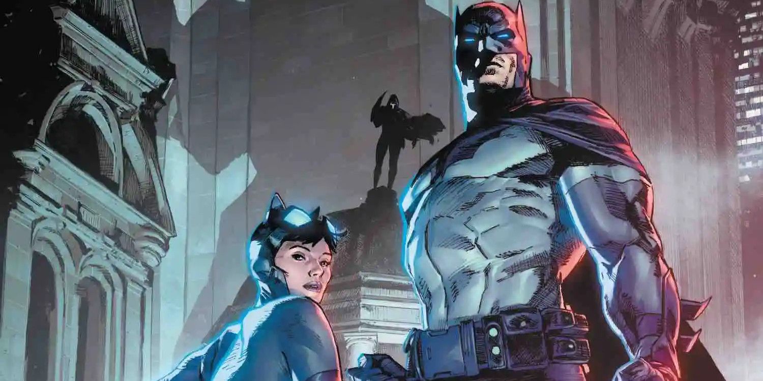 Batman and Catwoman stand on a building in Batman/Catwoman (2021) #2