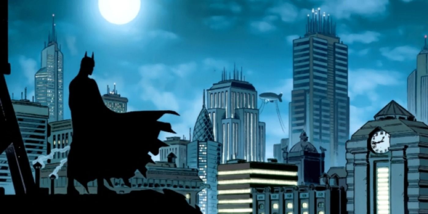 The shadowy silhouette of Batman overlooking Gotham City at night in comic art