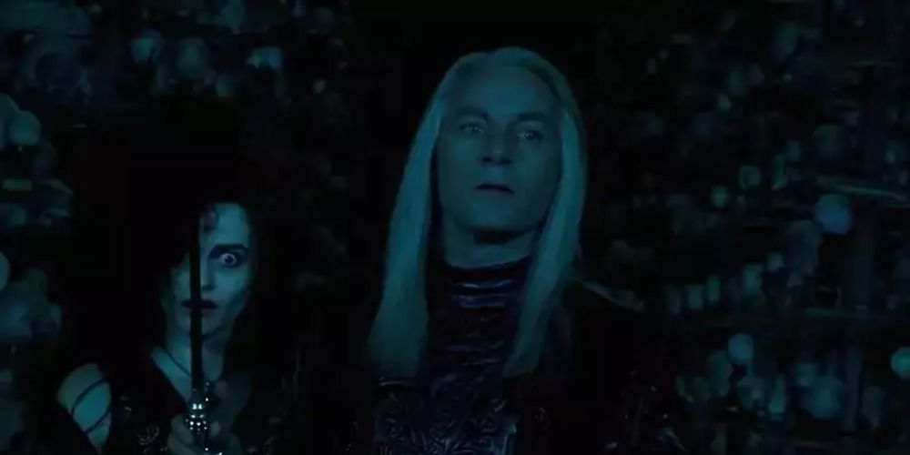 Bellatrix and Lucius Malfoy standing in the dark in Harry Potter