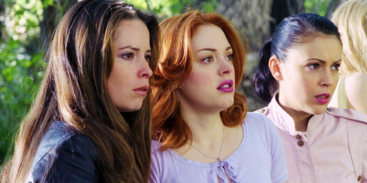 Piper, Paige, and Phoebe Halliwell stand next to each other in Charmed