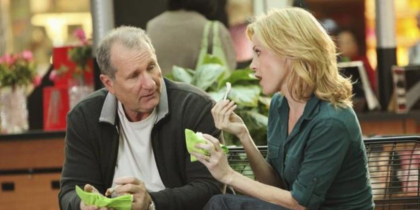 Claire and Jay talking in the mall over ice cream on Modern Family