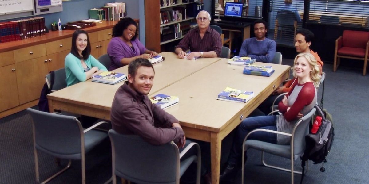 The cast of Community sitting at their table in study group