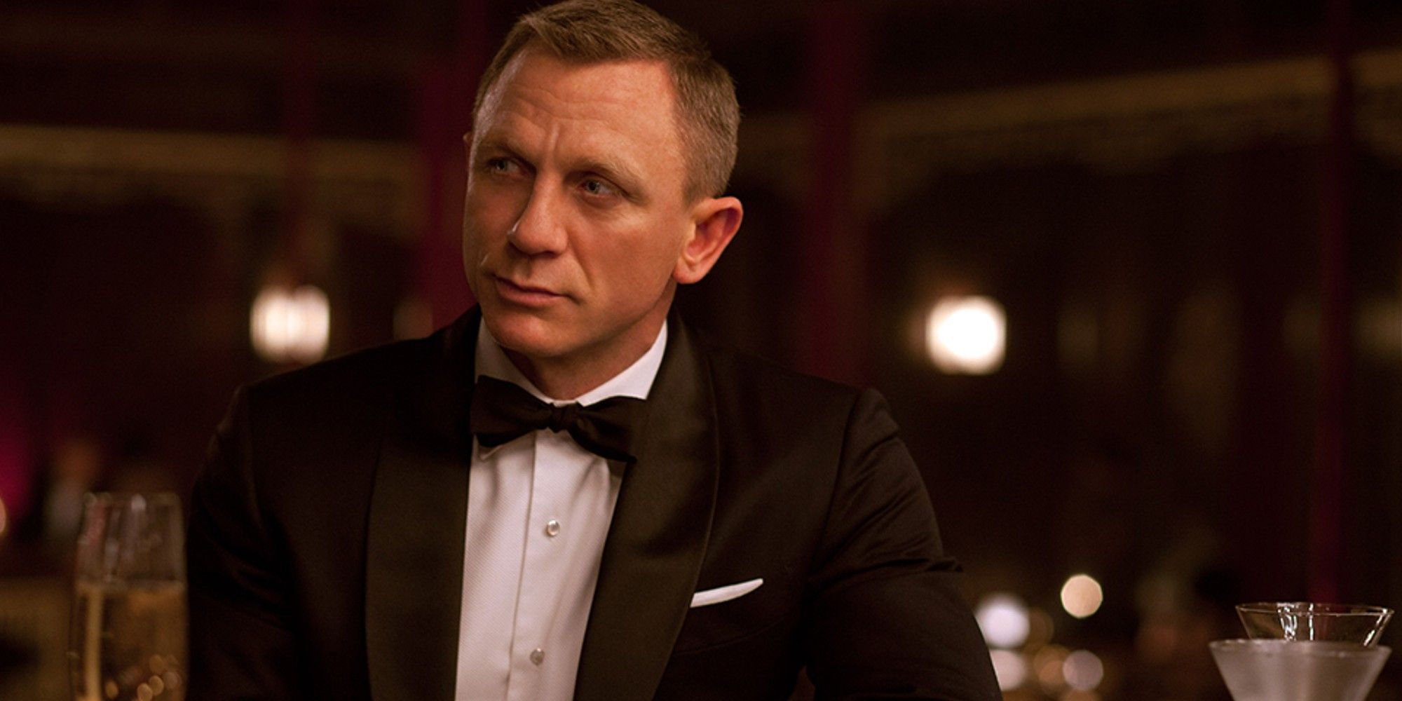 Daniel Craig as James Bond in a bar in No Time to Die