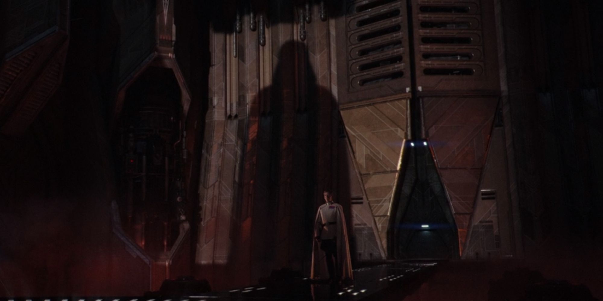 Darth Vader's shadow casting on the temple walls as Director Krennic watches in Rogue One A Star Wars Story