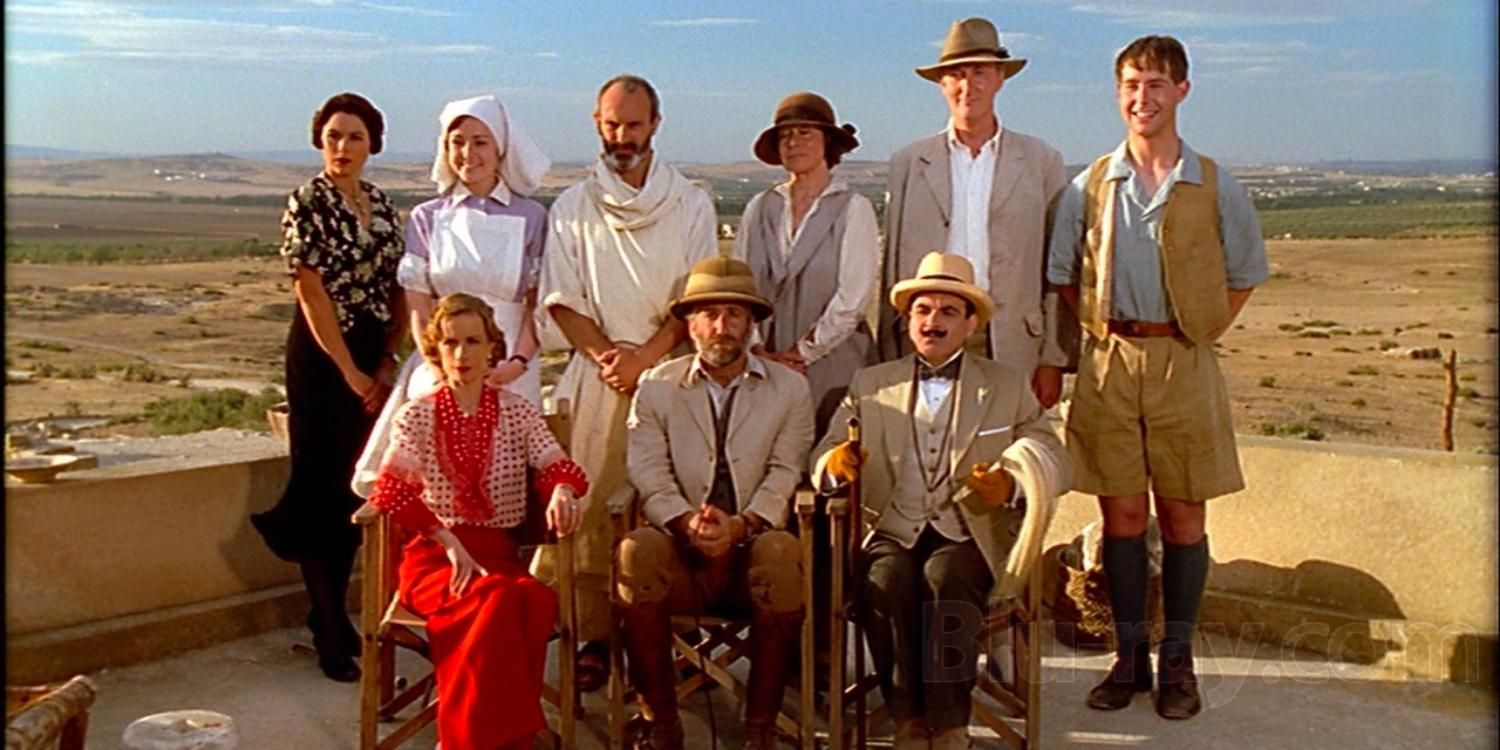 David Suchet as Hercule Poirot and the cast of Murder in Mesopotamia on a rooftop