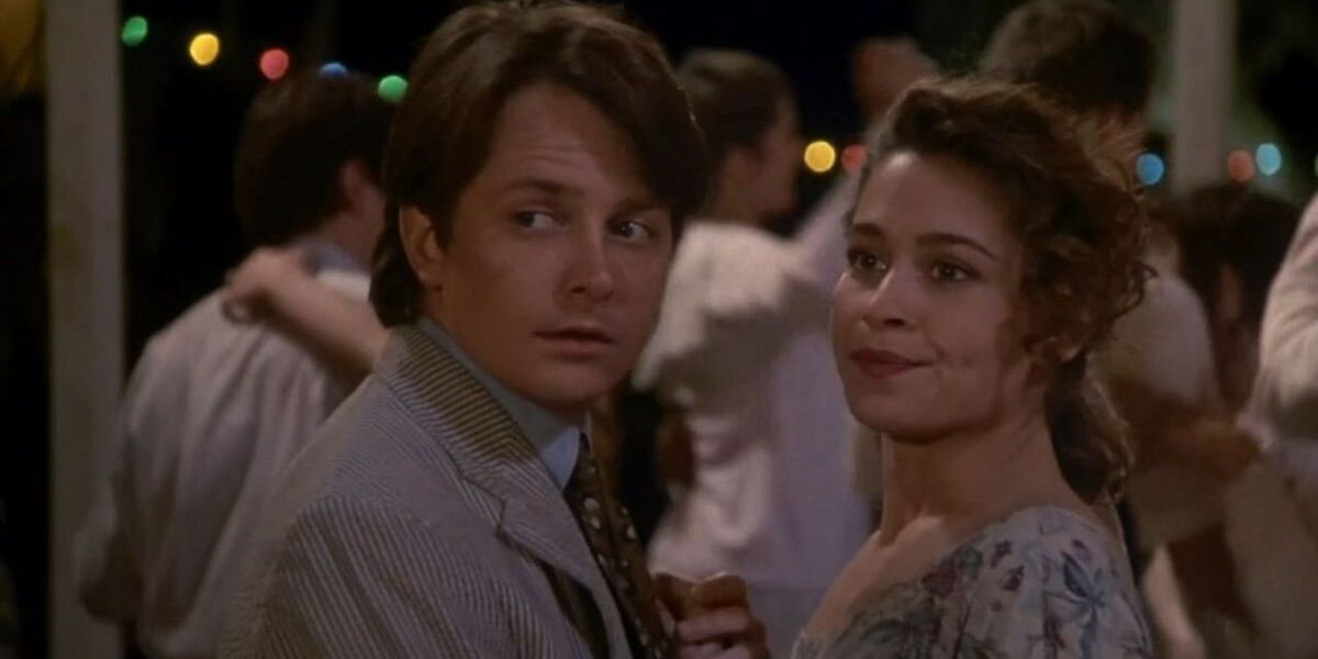 A man and woman look back at a party from Doc Hollywood