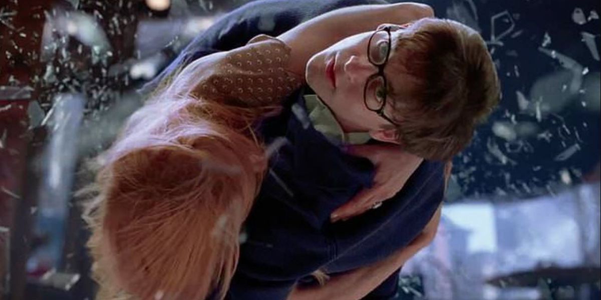 Peter diving to safety with Mary-Jane as glass breaks around them in Spider-Man 2