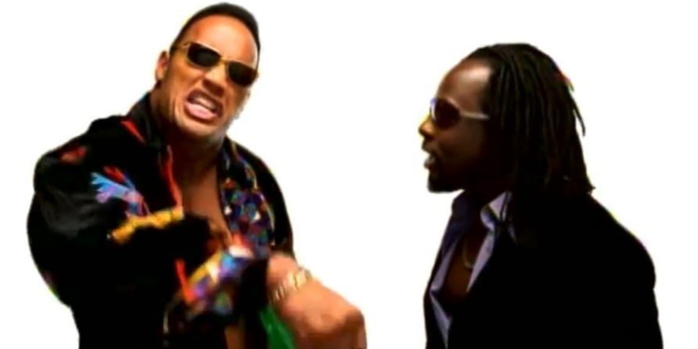 Dwayne Johnson shouts and Wycleaf Jean looks at him in the music video for It Doesn't Matter