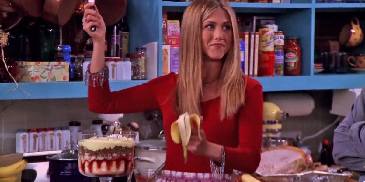 Rachel makes food in the kitchen in Friends.