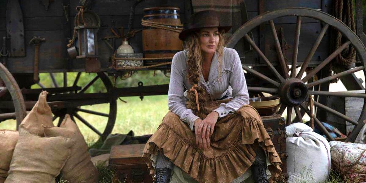Margaret Dutton (Faith Hill) sitting by a wagon in 1883