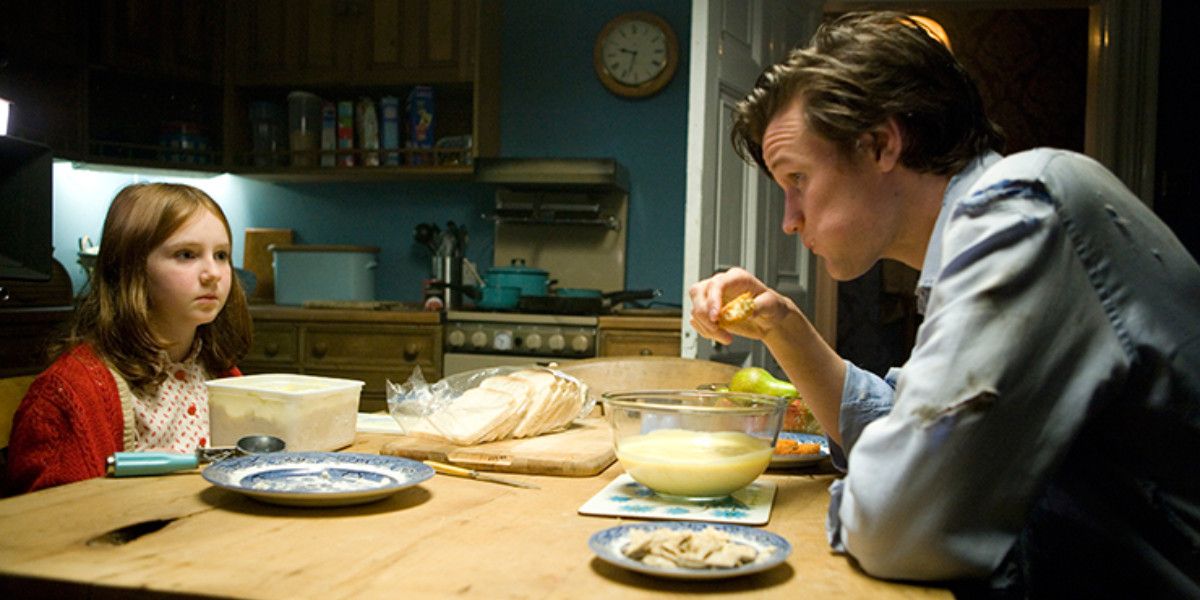 Doctor Who eats food with a young Amy in Doctor Who.
