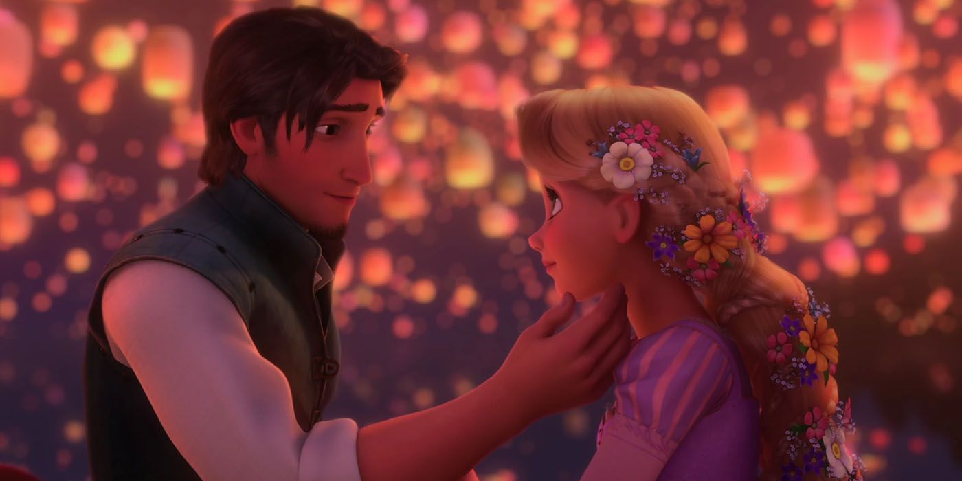 Flynn cups Rapunzel's chin in his hand in Tangled