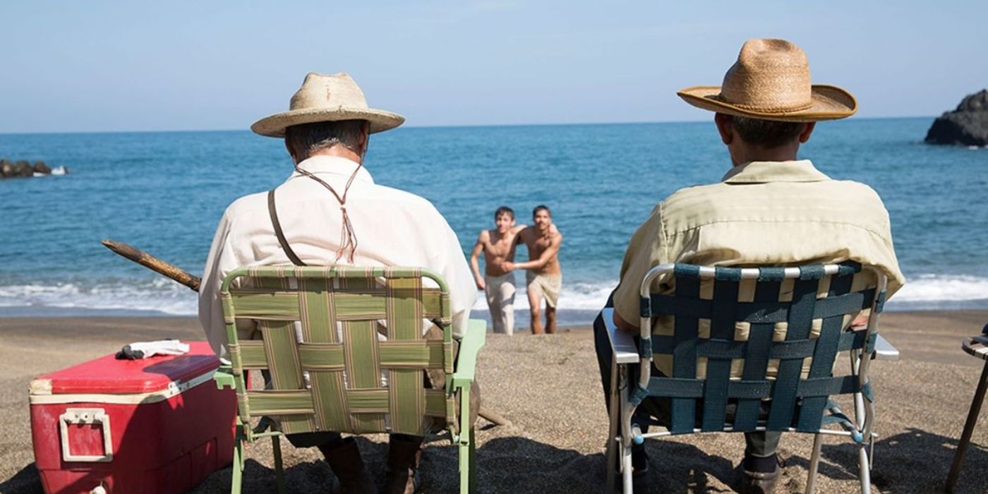 Four men on a beach in I Dream In Another Language.