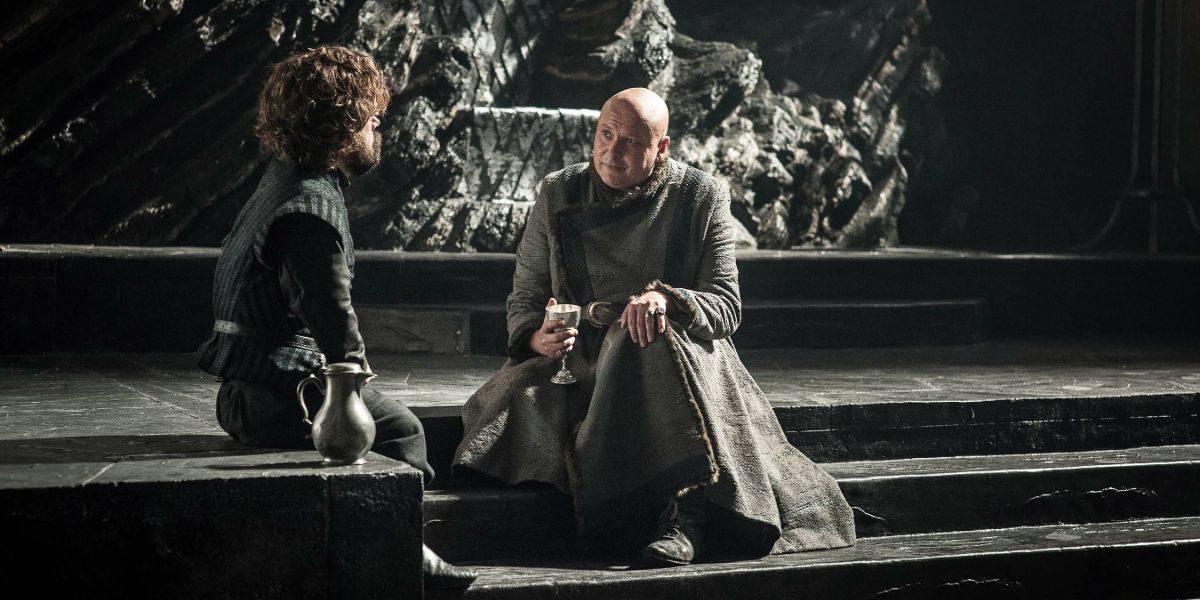 Varys and Tyrion sitting on steps talking