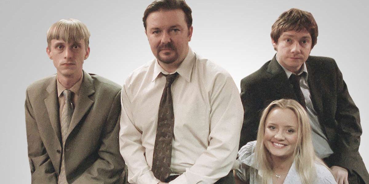 Gareth, David, Tim and Dawn pose for a picture in The Office UK.