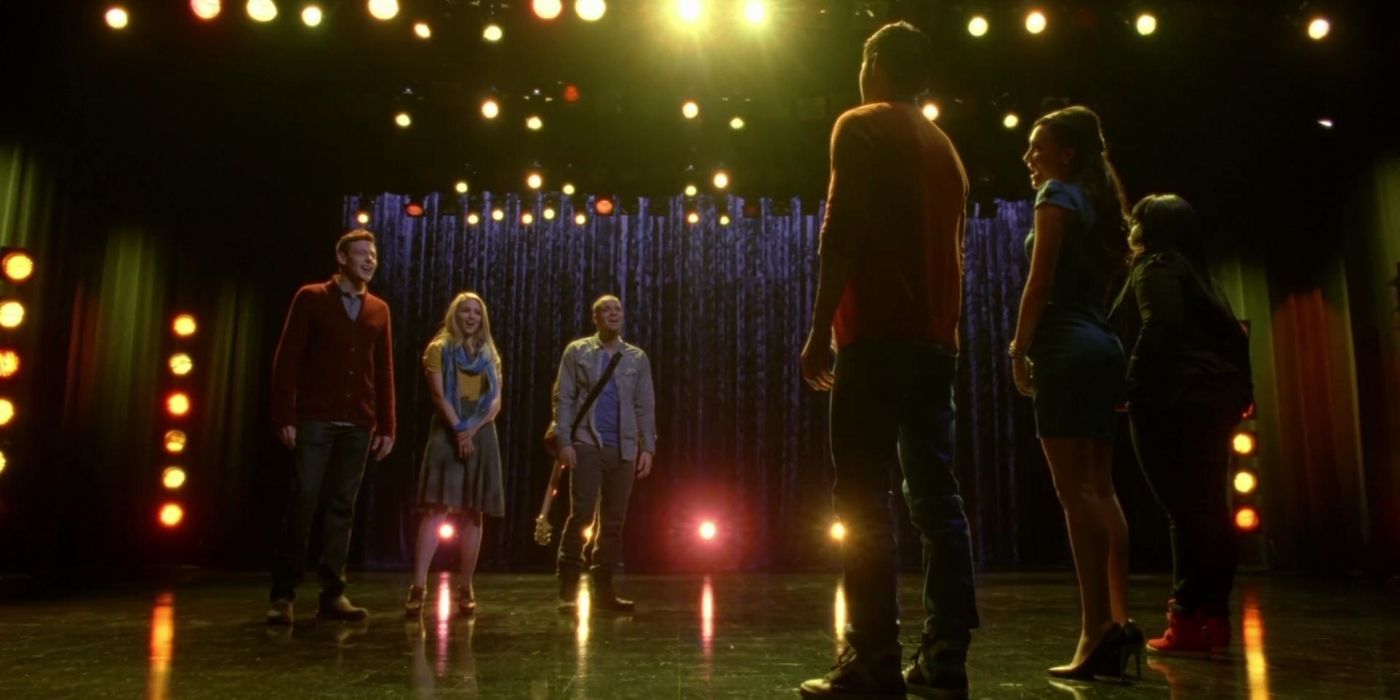 The New Directions' seniors performing on stage in Glee