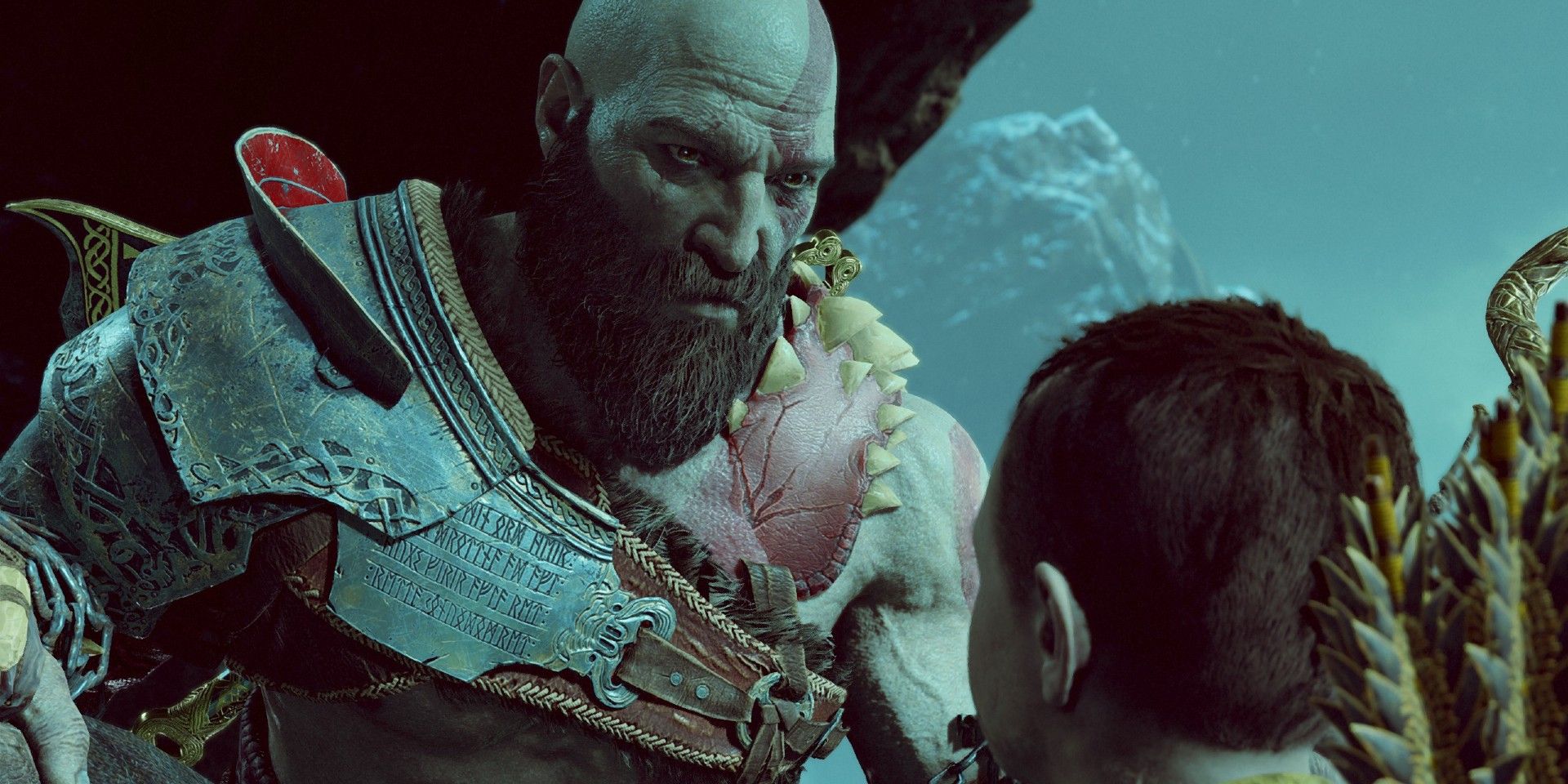 An image of Kratos talking to Atreus in God of War
