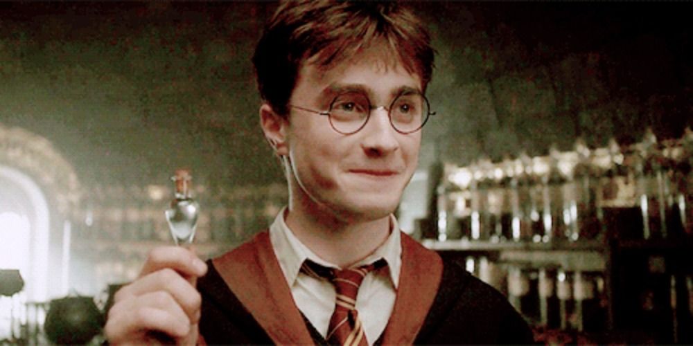 Harry Potter holding a bottle of liquid luck and smiling