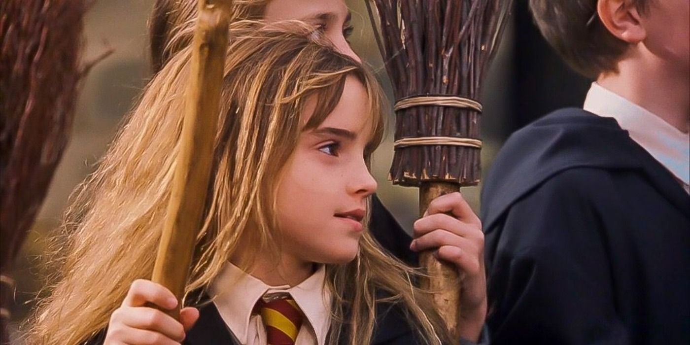 A young Hermoine holding her broom.