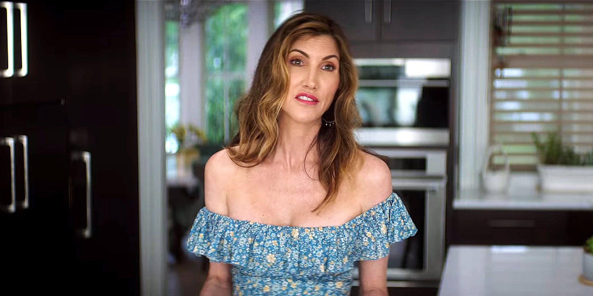 Beth stands in her kitchen in Home Team