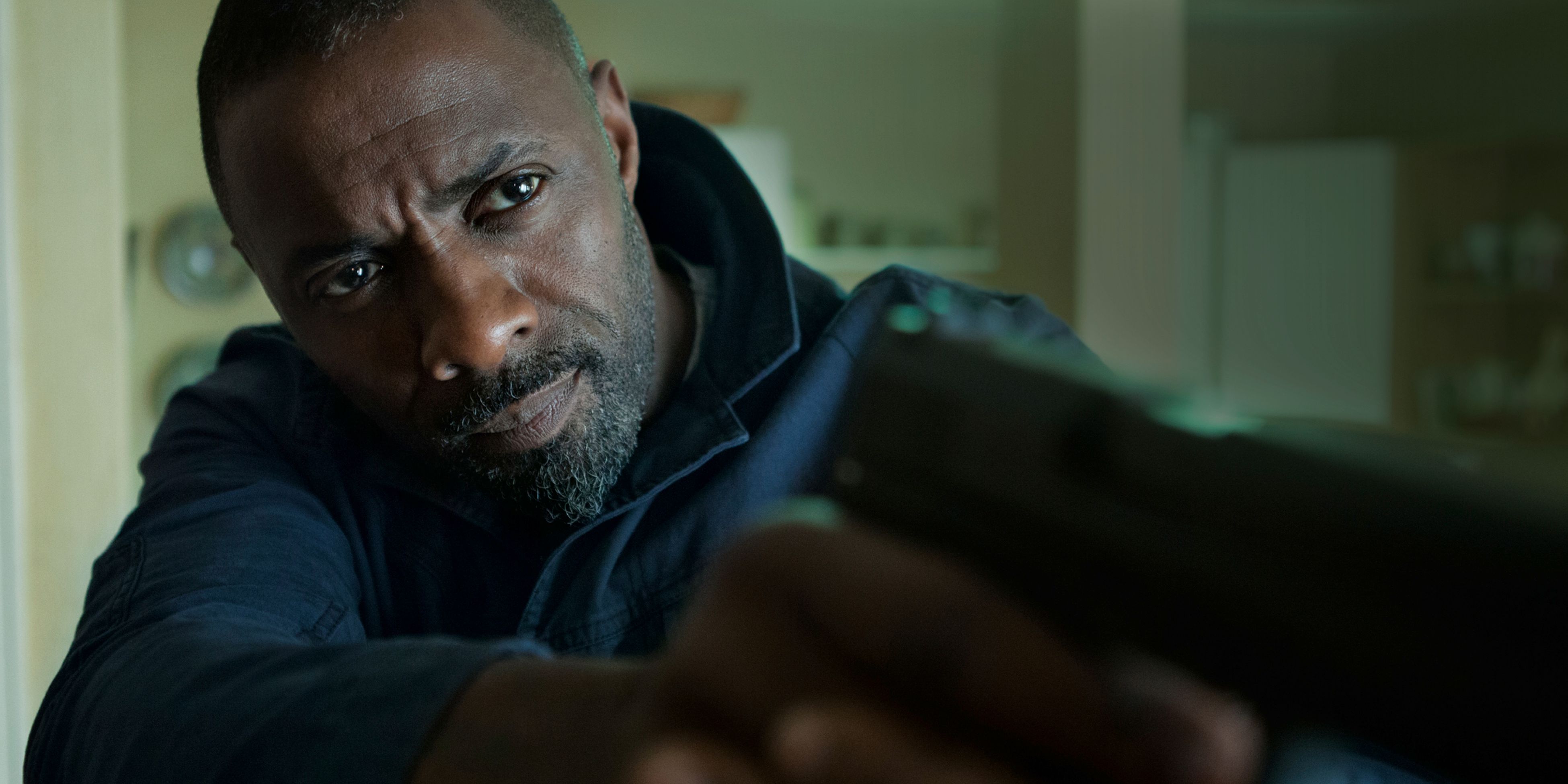 Idris Elba with gun