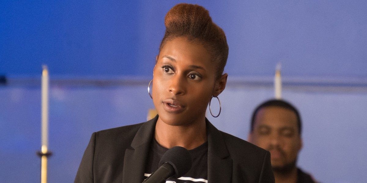 Issa Rae speaks on a mic in The Hate U Give