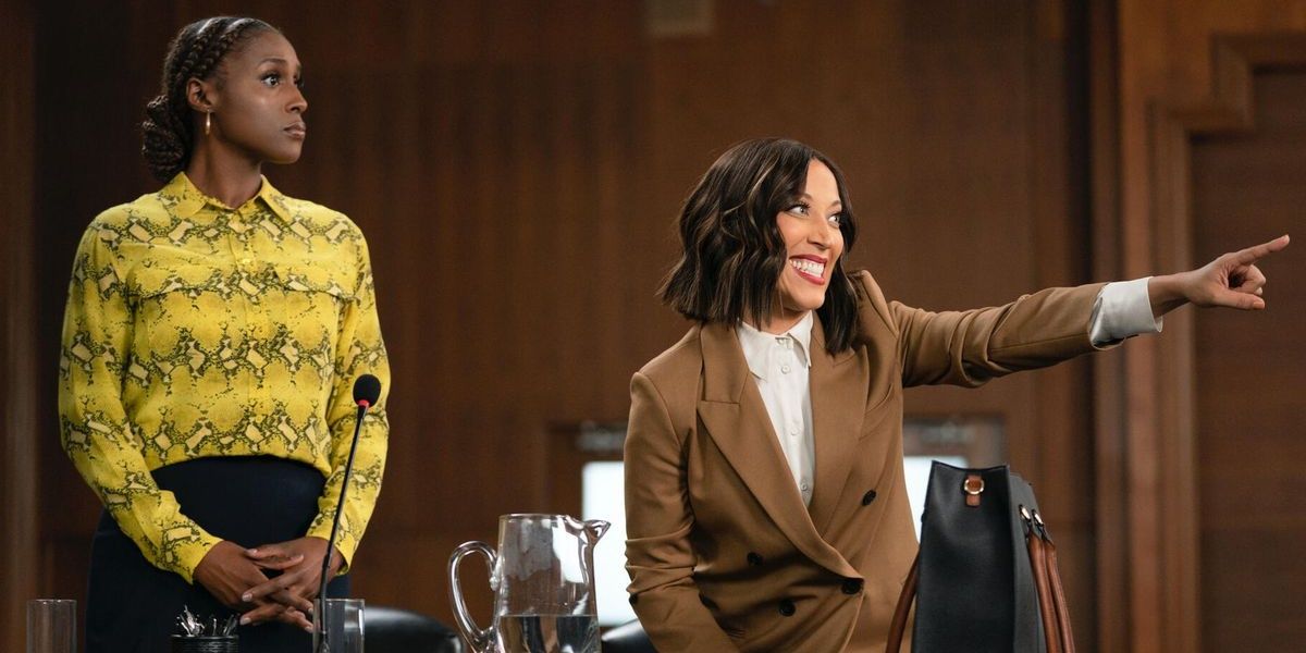 Issa Rae stands in a courtroom while Robin Theide points a finger and looks sideways in a still from A Black Lady Sketch Show
