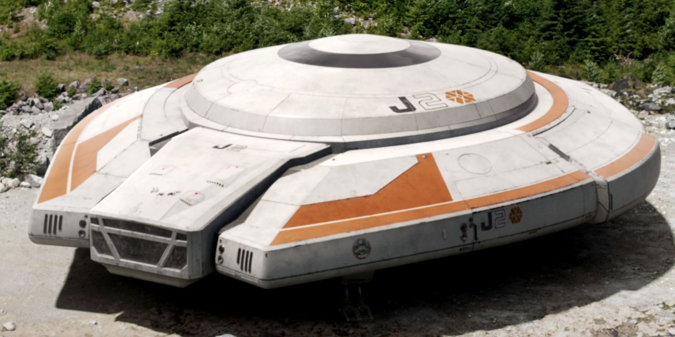 The Jupiter 2 sits in the forest area of the unknown planet in Lost In Space Season 1