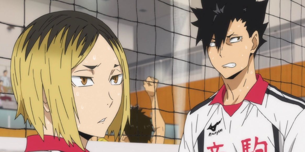 Kenma and Kuroo stand in front of a volleyball net, looking offscreen. Kenma looks bored and Kuroo looks irritated.