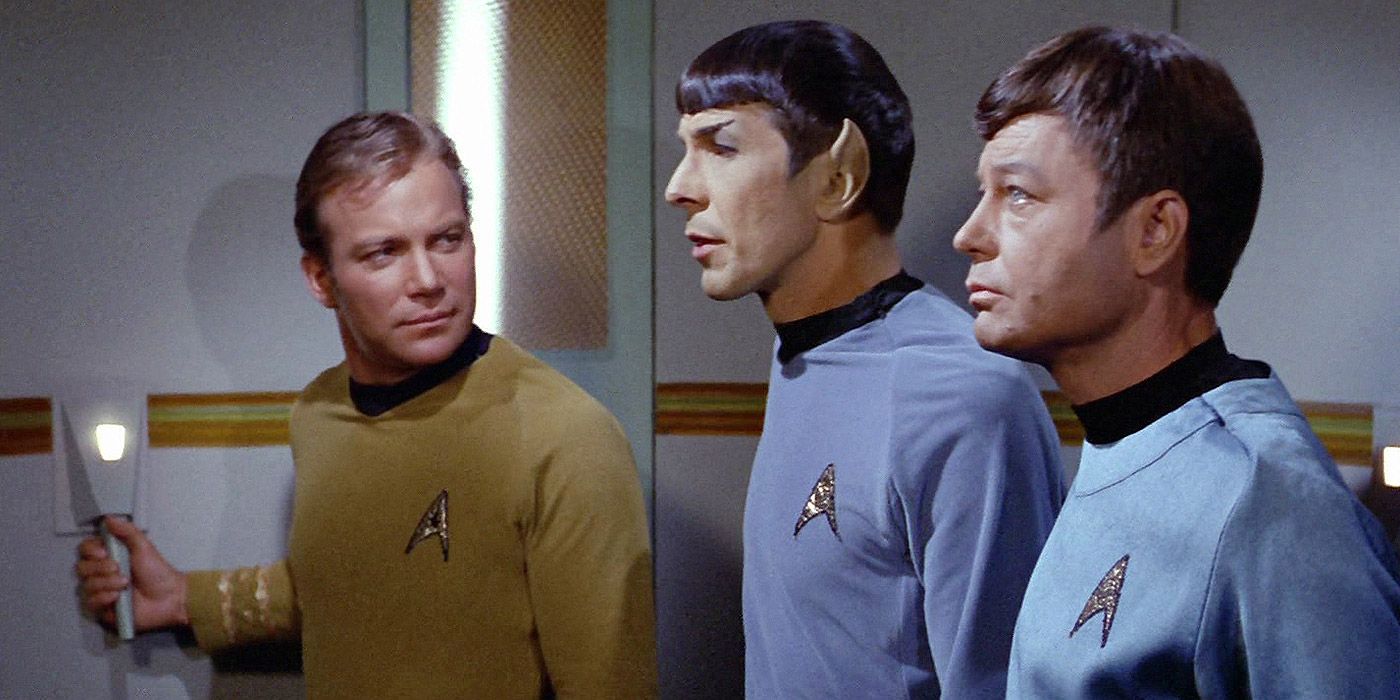 Captain Kirk, Spock and McCoy ride a turbo lift in Star Trek